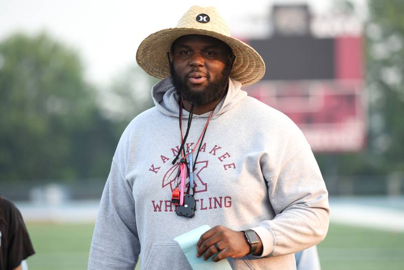 Kankakee football coach Ed Hazelett addresses the team following their summer camp Thursday, July 31, 2025.