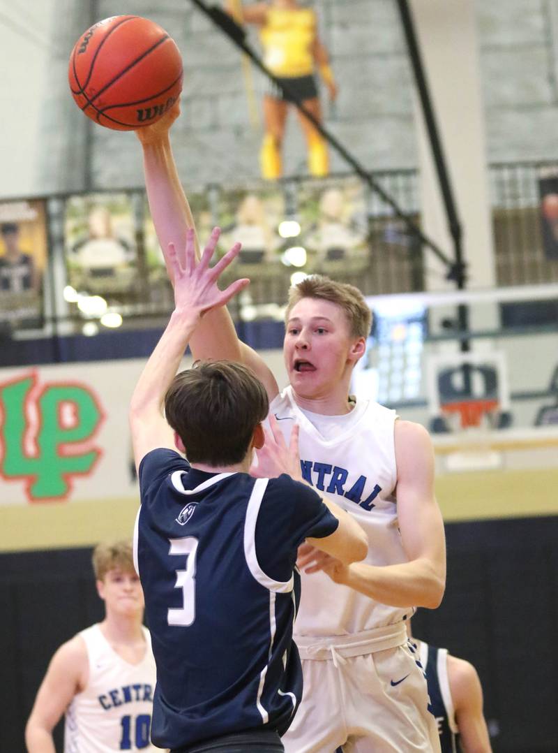 Burlington Central's Andrew Scharnowski passes the ball over Cary-Grove's Kyle Ochwat during their Class 3A regional game Tuesday, Feb. 23, 2022, at Sycamore High School.