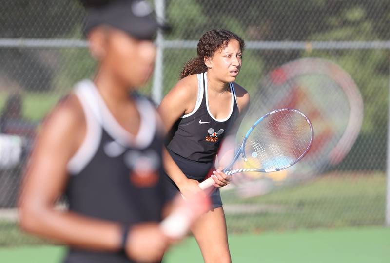 DeKalb's Amirah Shukir and Ilanie Castorena prepare to receive serve during their doubles match against Sycamore Monday, September 19, 2022, at Sycamore High School.