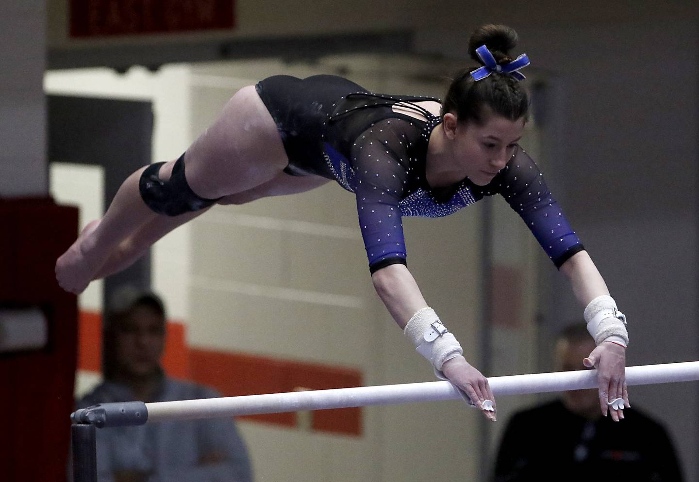 Wheaton Warrenville South's Mia LaFratta competes on the uneven parallel bars during the IHSA Girls State Gymnastics Meet at Palatine High School on Saturday, Feb. 17, 2024.