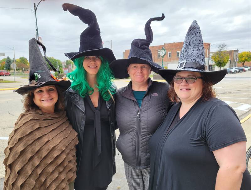 Marseilles Rotary Club representatives Linda Taglia (from left), Amanda Hart, Sherri Laitila and Tricia Parker don their best witches wear to call attention to the Rotary’s first “Witches and Warlocks Walk,” to be held Saturday, Oct. 21 from 7-9 p.m. in downtown Marseilles.