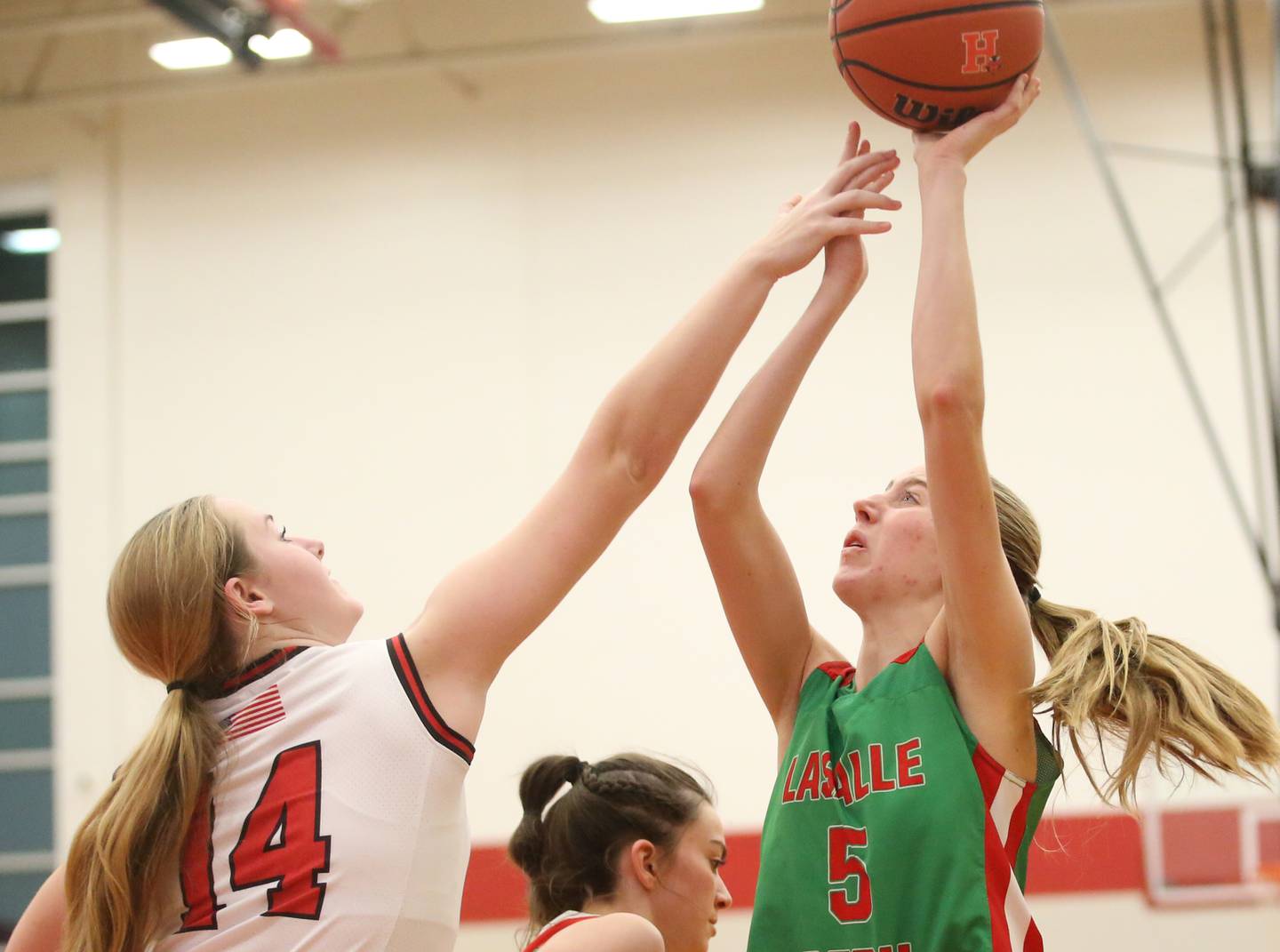 L-P's Addison Urbanski eyes the hoop while Hall's Ella Sterling defends on Monday, Dec. 11, 2023 at Hall High School.