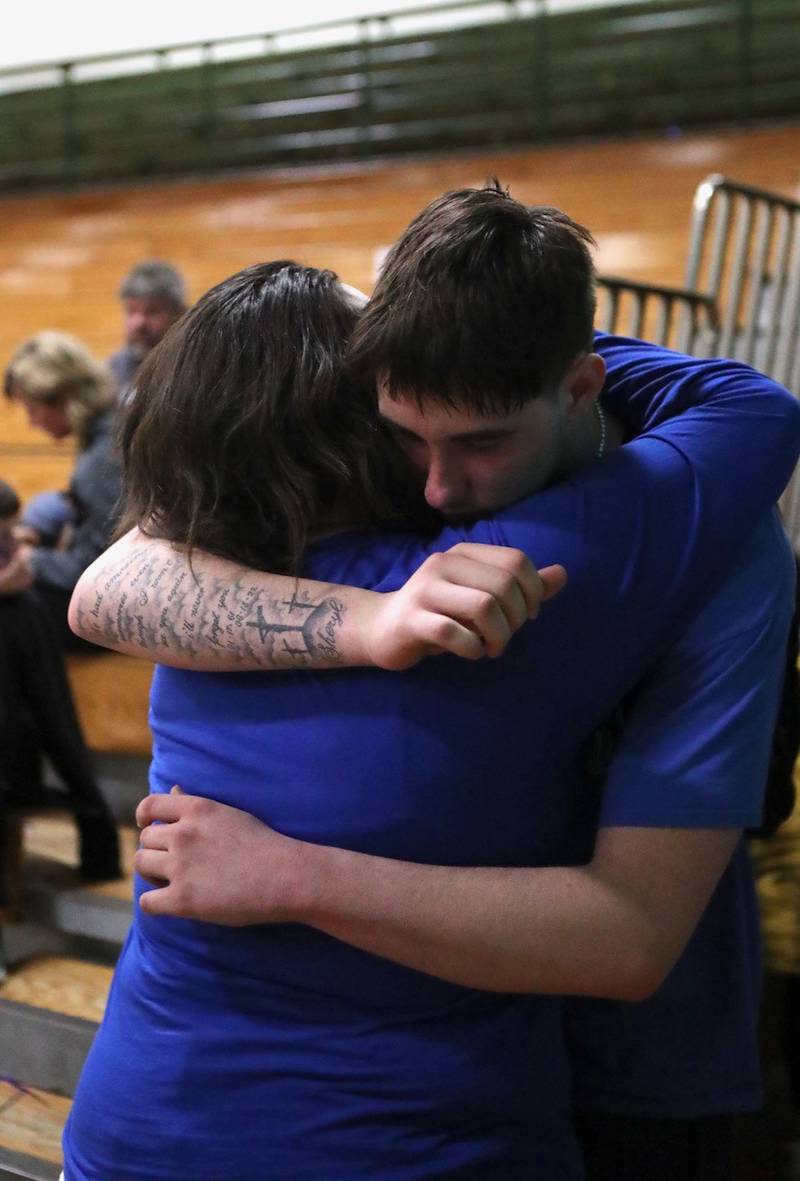 Princeton senior Kolten Monroe gets a hug from his mother after Friday's Class 2A Orion Sectional championship at Geneseo.
