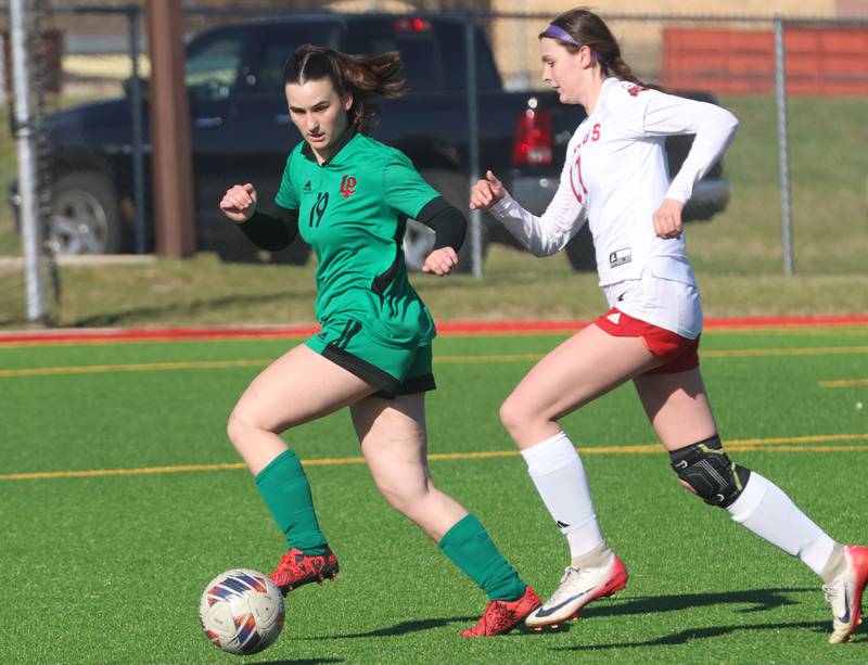 L-P's Clare Domyancich and Streator's Briana Chavez chase after the ball on Friday, March 27, 2026 at the L-P athletic complex in La Salle.