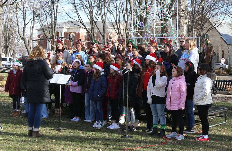 Central and Shepard Middle School choirs sing Christmas carols at Washington Park for the 14th annual 'Freezin for a Reason' event on Friday, Dec. 2, 2022 in Ottawa.