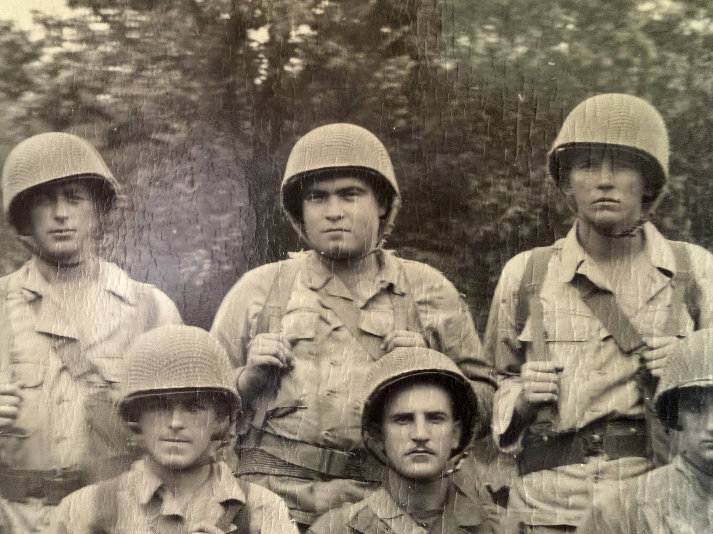 Harold Beck (back row, center) is photographed during his time in training in the United States Army.