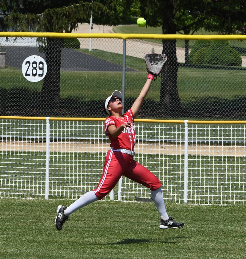 Oregon centerfielder Giselle Zavala stretches to make the catch as she chases down a Rock Falls' fly ball for an out during the championship game at the 2A Oregon Regional on Saturday, May 23, 2026 at Oregon Park West.