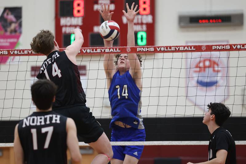 Lincoln-Way East’s Nate Webster blocks a shot against Plainfield North on Tuesday, April 2, 2024.