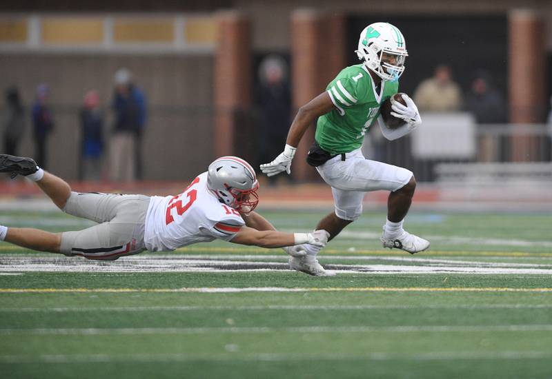 York’s Kelly Watson escapes Palatine’s Aiden Wimer in a Class 8A quarterfinal playoff football game in Elmhurst on Saturday, November 12, 2022.