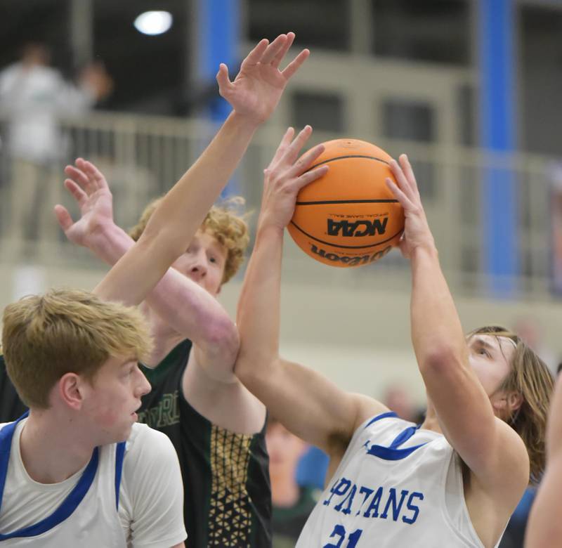 St. Francis’ Colin White grabs a rebound against St. Edward in a boys basketball game in Wheaton on Tuesday, December 6, 2022.