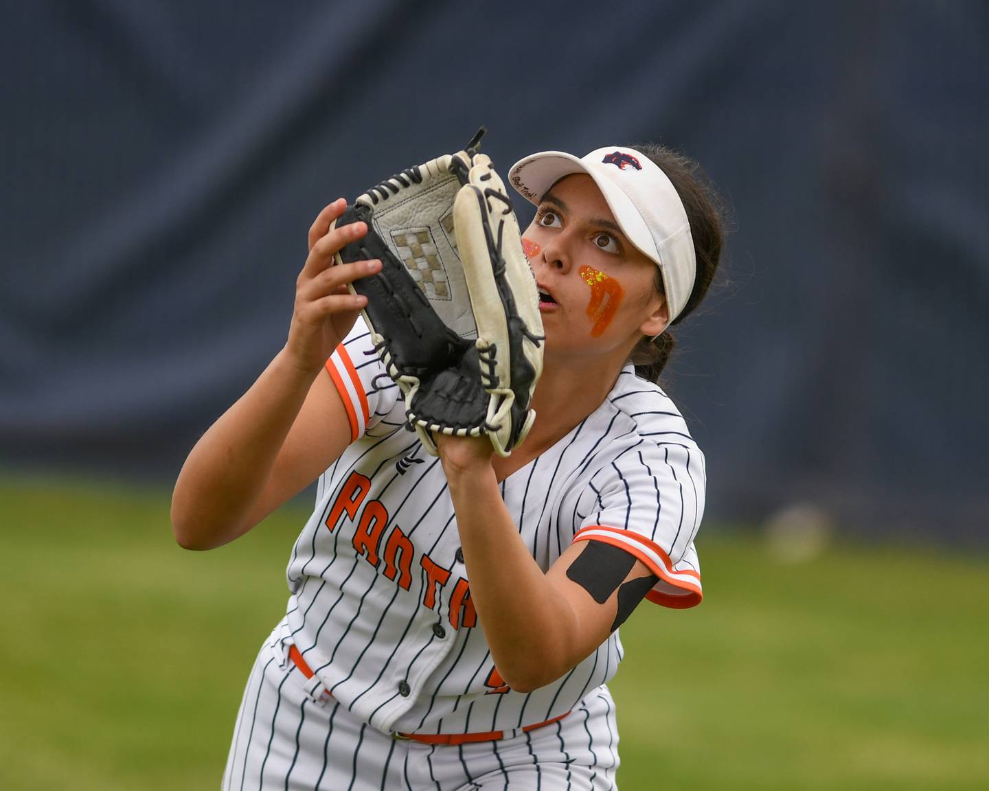 Oswego's Ellalina Mahoney (7) keeps her on the ball before catching it for an out during the regional final game against Benet Academy on Friday May 22, 2026, held at Oswego High School.