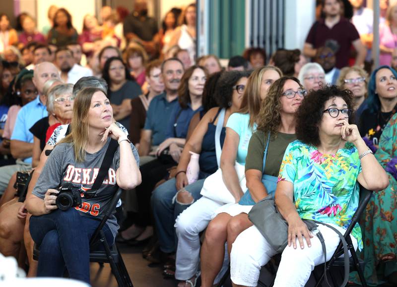 Attendees watch a video about the new school and its namesake Leroy Mitchell Friday, Aug. 8, 2025, during the grand opening celebration for the school that bears his name, Dr. Leroy A. Mitchell Elementary School in DeKalb.