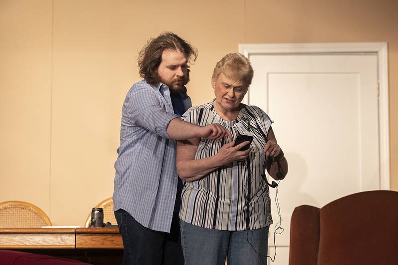 Alice, played by Mary Jo Frederick, is helped out by the spirit of her son Jack, Joel Megill, during a rehearsal of PACT’s The Tin Woman Wednesday, Feb. 19, 2025.