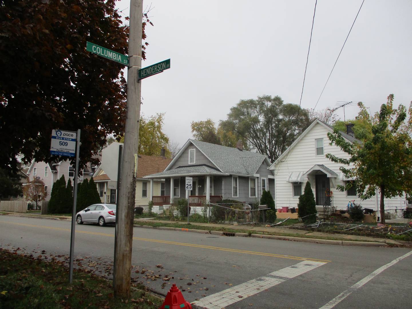 Street sign marks the corner of Henderson Avenue and Columbia Street in Joliet where a man died Sunday afternoon when he was shot while driving. Oct. 31, 2022.