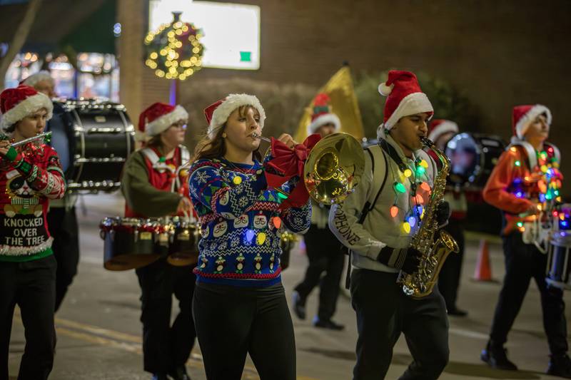 The Westmont High School Marching Sentinels perform during the annual Holly Days Frosty & Friends Parade in Westmont on Saturday, December. 7, 2024.