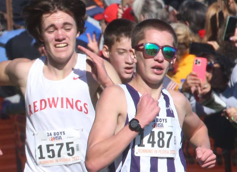 Glenbard South's Benet Academy's Charlie Phelan and Dixon's Aaron Conderman compete in the Class 2A State Cross Country race on Saturday, Nov. 4, 2023 at Detweiller Park in Peoria.