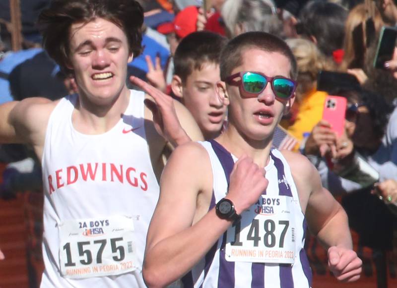 Glenbard South's Benet Academy's Charlie Phelan and Dixon's Aaron Conderman compete in the Class 2A State Cross Country race on Saturday, Nov. 4, 2023 at Detweiller Park in Peoria.