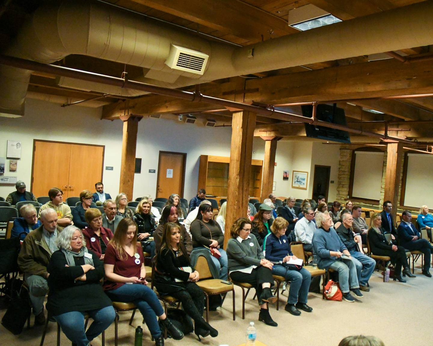 Community members listen to candidates during a forum on Thursday Feb. 24, 2024, held at Batavia’s City Hall.