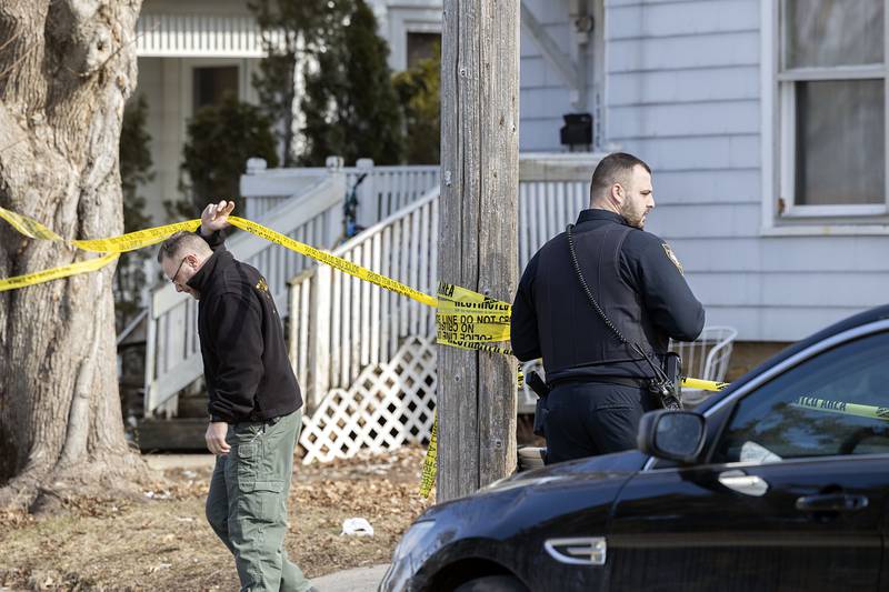 Investigators work at the scene Monday, Feb. 20, 2023 of a Sunday night shooting in the 1100 block of 4th Ave. in Sterling. One victim was pronounced dead with four taken into custody.