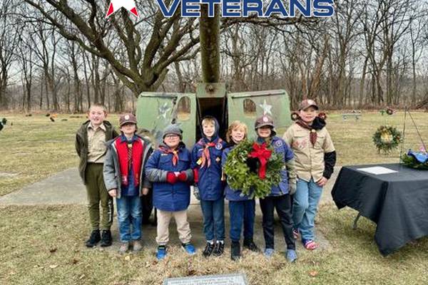Local volunteers working to honor  veterans at Joliet’s Woodlawn Cemetery with Christmas wreaths