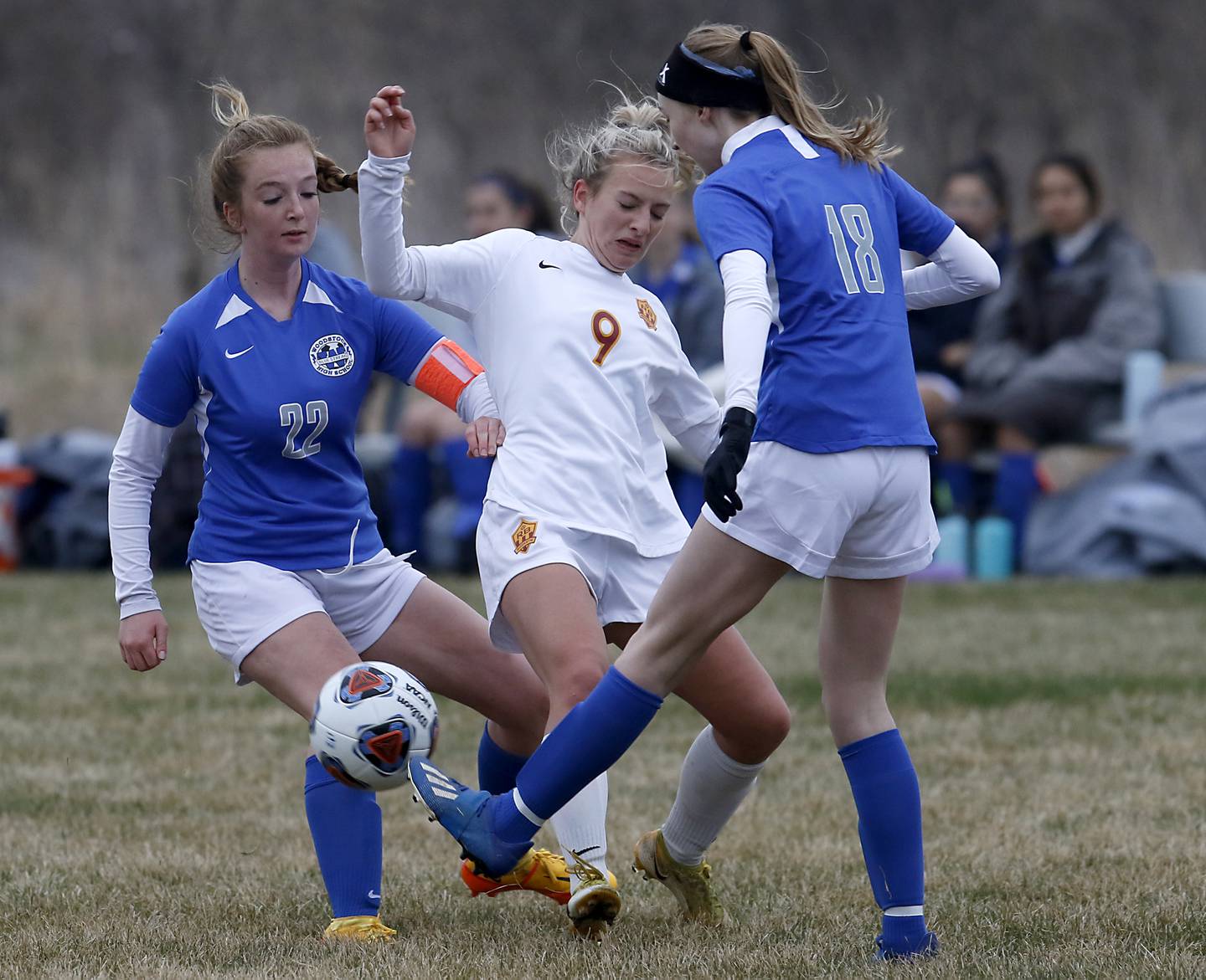 Richmond-Burton's Reese Frericks has the ball kicked away by Woodstock's Lily Novelle, right, and Woodstock's Reese Freund, left, during a Kishwaukee River Conference soccer match Wednesday, April 30, 2022, between Richmond-Burton and Woodstock at Creekside Middle School.