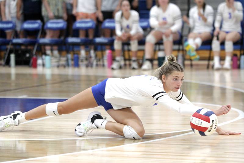 Rosary’s Clare Mceniry dives for the ball during a game against St. Charles North in Aurora on Monday, Aug. 21, 2023.