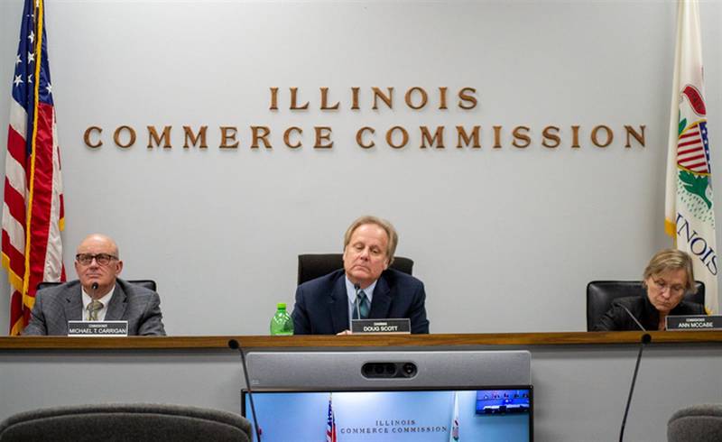 Illinois Commerce Commission member Michael Carrigan (left), Chair Doug Scott, and member Ann McCabe are pictured at a commission meeting in Springfield earlier this month.