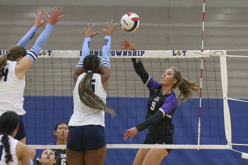 Downers Grove North's Kelley Crowley (9) smashes a kill during Class 4A Lyons Sectional Semifinal volleyball match between Downers Grove South at Downers Grove North. Nov 4, 2025 in La Grange.