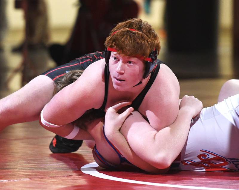Fulton's Manik Eads holds Oregon's Jasper Messenger at 195 pounds during a triangular meet with Polo at Oregon High School on Thursday, Dec. 4, 2025.