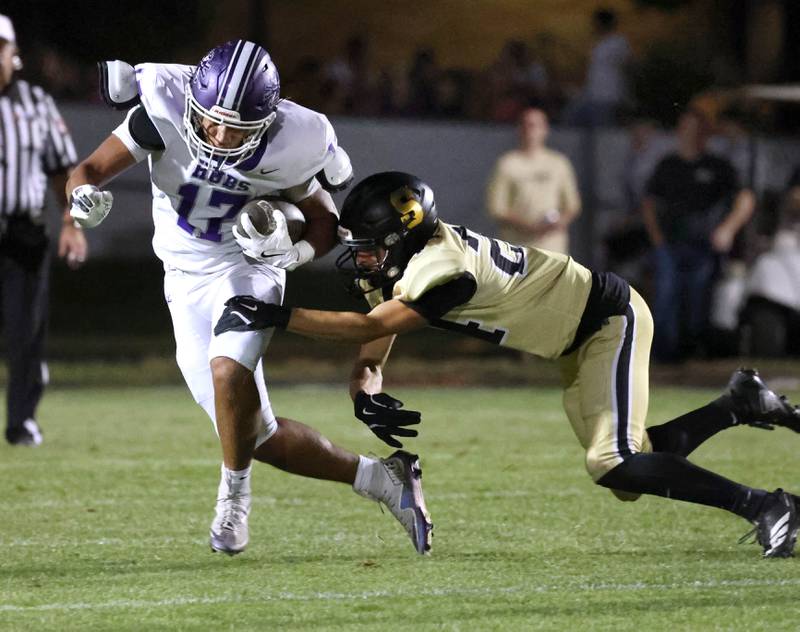 Rochelle's Reece Harris tries to get by Sycamore's Crewe Bartelt during their game Friday, Sept. 19, 2025, at Sycamore High School.