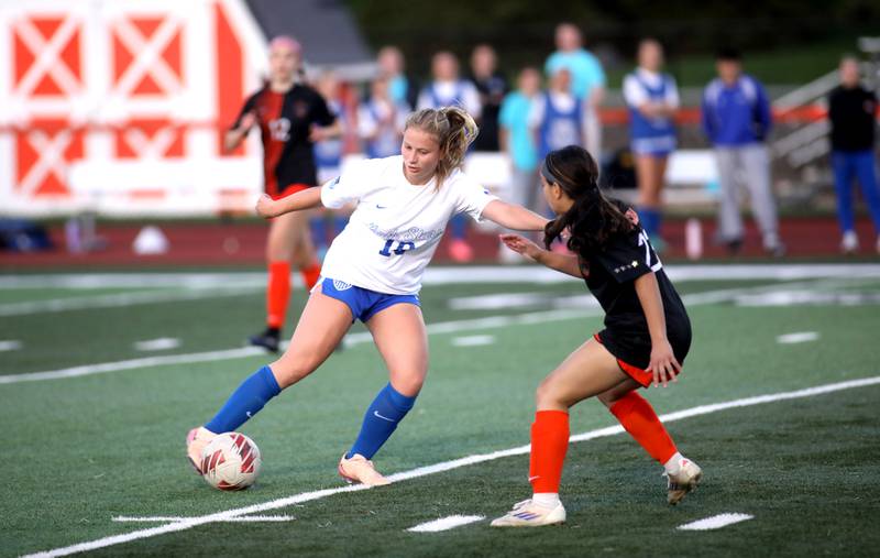 St. Charles North’s Chloe Kirsten kicks the ball during a Tri-Cities Soccer Night game against St. Charles East on Tuesday, April 29, 2025 in St. Charles.