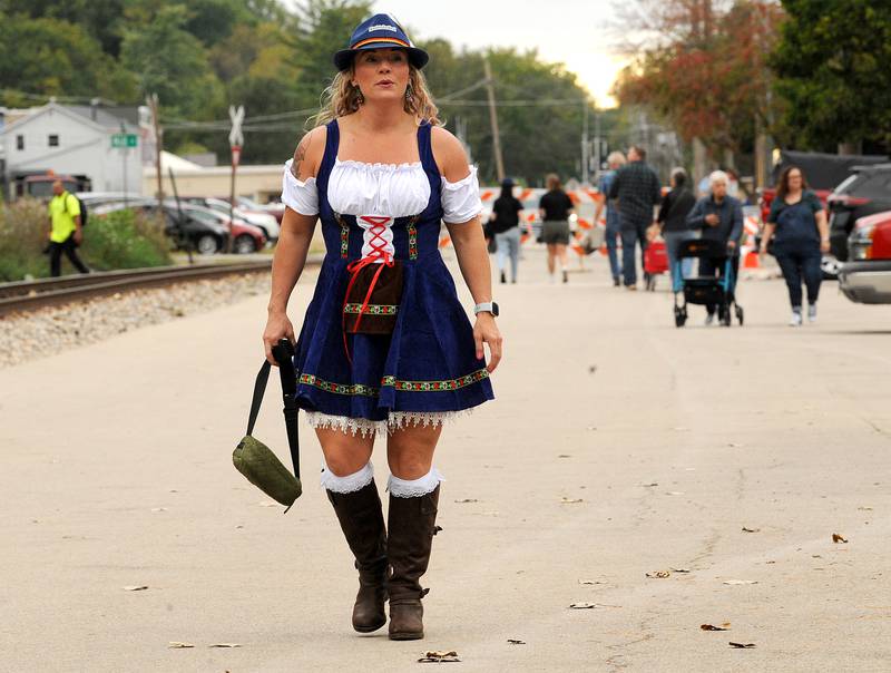 Dressed up in her Dirndl, volunteer beer server Emily Rollins, reports for duty during Yorktoberfest, Saturday, Sept. 28, 2024, in Riverfront Park in Yorkville.
