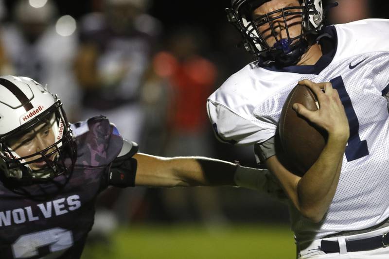 Prairie Ridge's Ryan Koelblinger tries to tackle Cary-Grove's Payton Seaburg during a Fox Valley Conference football game between Prairie Ridge  and Cary-Grove Friday, Sept. 23, 2022, at Prairie Ridge High School in Crystal Lake.