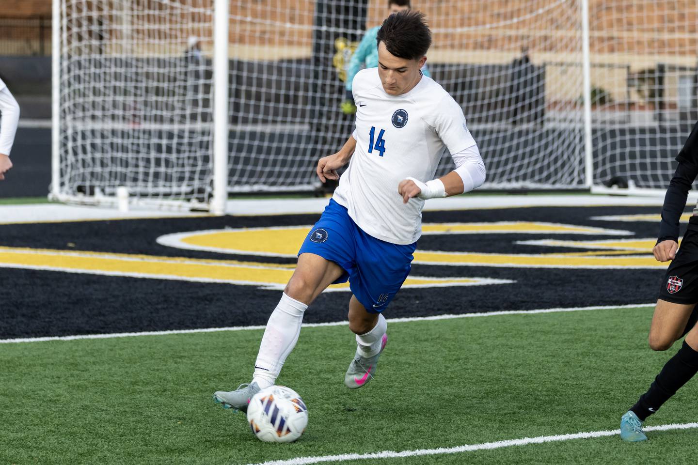 Lincoln-Way East's Owen Bohren takes control of the ball during the 3A Joliet West Sectional boys varsity soccer match against Lincoln-Way Central at Joliet West on Oct. 29, 2025.