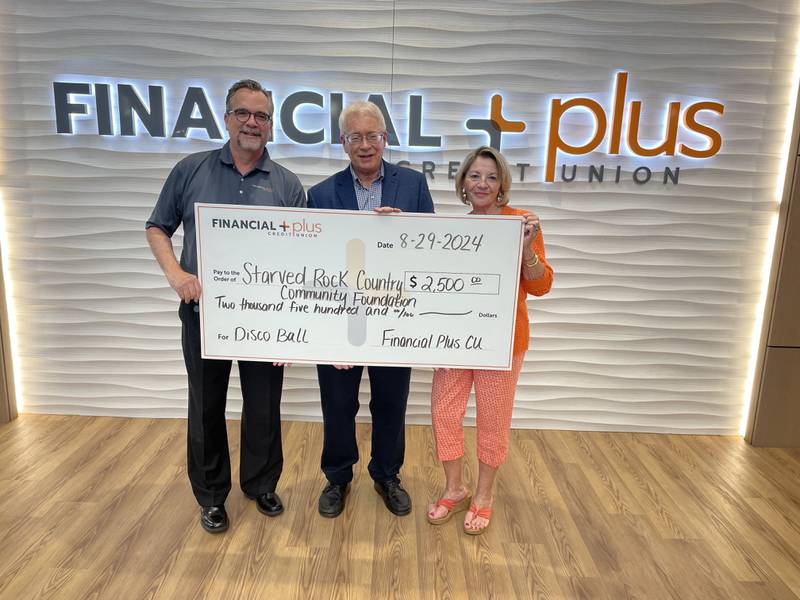 Financial Plus Credit Union President and CEO Peter Fauth (from left), presented a  $2,500 check to Starved Rock Country Community Foundation board chair Reed Wilson and the foundation's co-founder Pamela Beckett. The money will go toward the foundation's third annual Disco Ball.