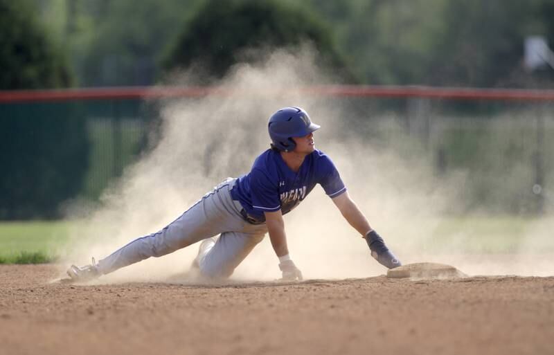 Wheaton North’s Tyler O’Connor slides into second base during a game at St. Charles East on Monday, May 15, 2023.
