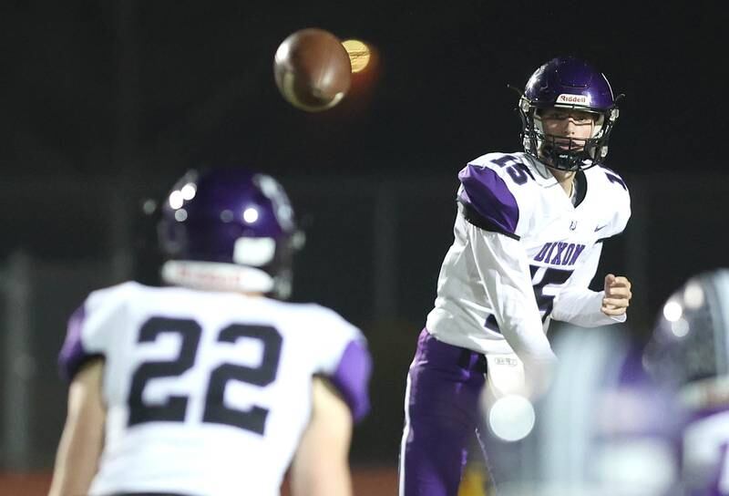 Dixon quarterback Tyler Shaner throws a pass to Aiden Wiseman during their first round playoff game against Rochelle Friday, Oct. 28, 2022, at Rochelle High School.
