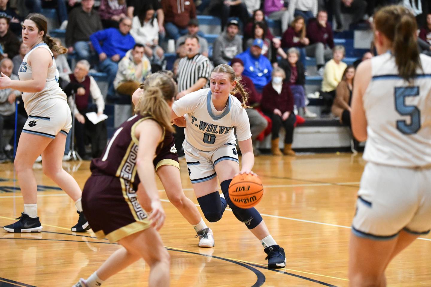Cissna Park's Addison Lucht drives to the basket past Watseka-Milford defenders on Monday, Feb. 10, 2025, during the Timberwolves' 61-40 victory.