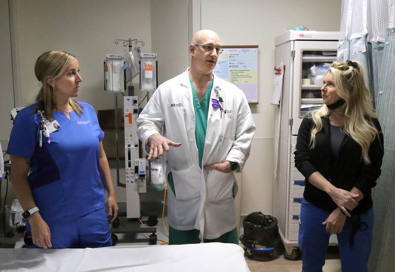 Nurse Randa Melms, (left) Dr. Gregory Conrad and nurse Nicole Lefever talk in the emergency room Thursday, April, 18, 2024, at Northwestern Medicine Kishwaukee Hospital in DeKalb.