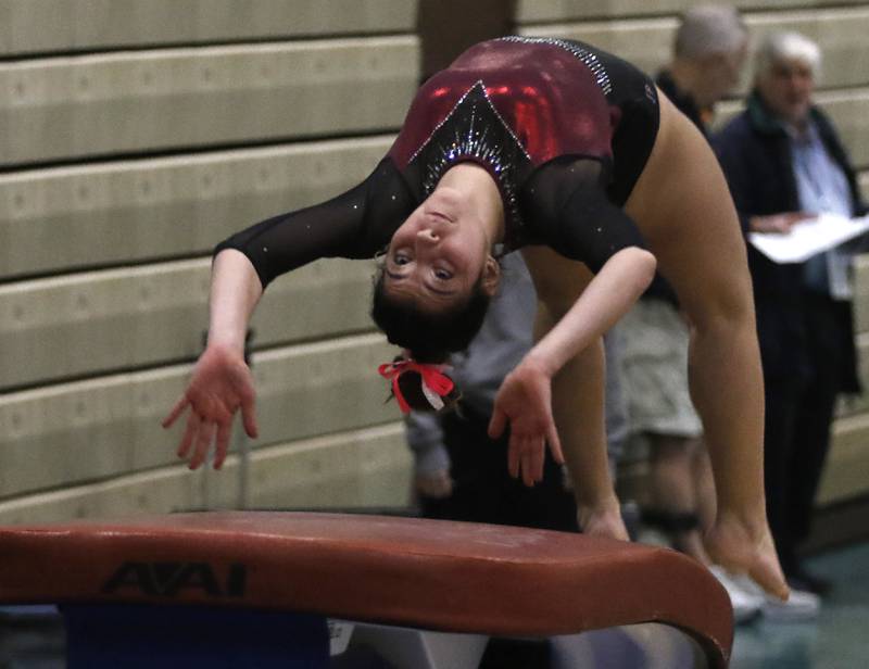 Prairie Ridge’s Maria Kakish competes in vault Wednesday, Feb. 8, 2023, during  the IHSA Stevenson Gymnastics Sectional at Stevenson High School in Lincolnshire.
