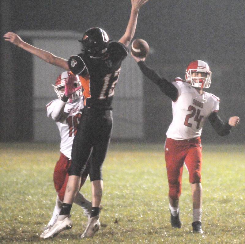 Flanagan-Cornell/Woodland's Logan Ruddy tries to block a pass from South Beloit's Landen Reed at the Wood Shed on Friday, Oct. 13, 2023.