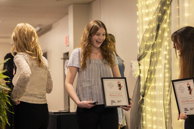 Madison Krum reacts to winning the Young Woman of Tomorrow Thursday, April 16, 2026, during the YWCA’s Women of Achievement Luncheon.