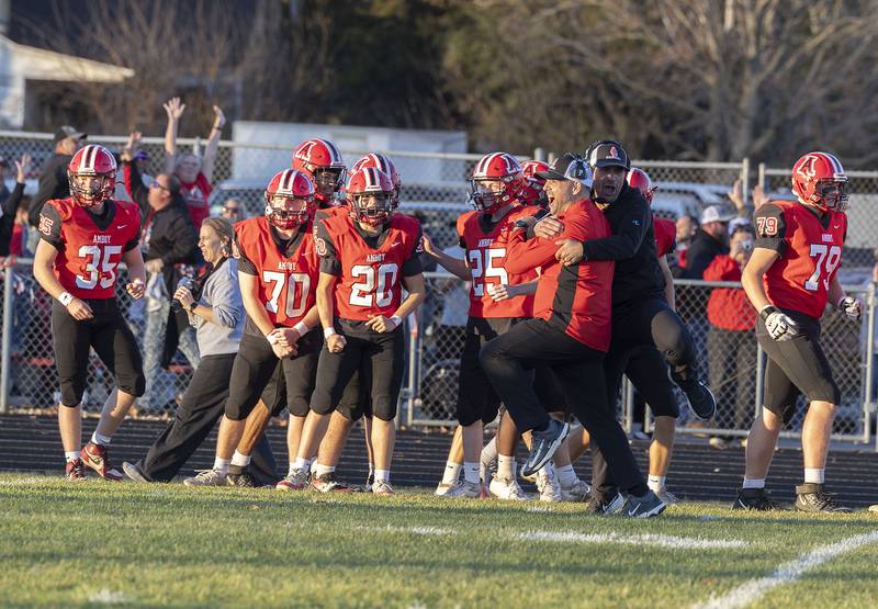 The Amboy sideline celebrates a late game touchdown against Milledgeville Saturday, Nov. 15, 2025, in the 8-man football semifinal.