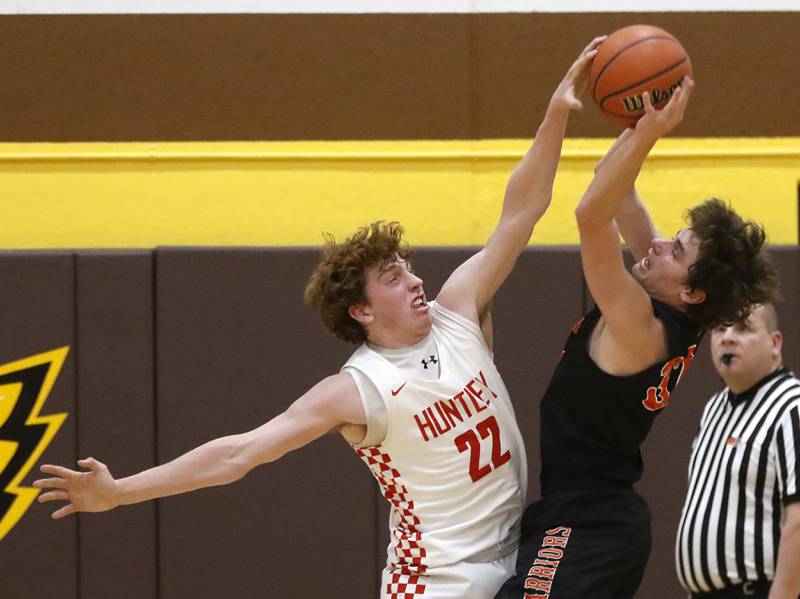 Huntley's Adam Guazzo blocks the shot of McHenry’s Anthony Fowler during a IHSA Class 4A Boys Regional basketball game Wednesday, Feb. 23, 2022, between Huntley and McHenry at Jacobs High School.