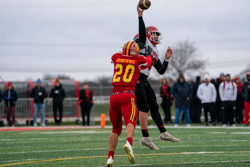 Batavia’s Brody Osborne (20) pressures Yorkville's Michael Dopart (16) during a 7A quarterfinal playoff football game at Batavia High School on Saturday, Nov 12, 2022.