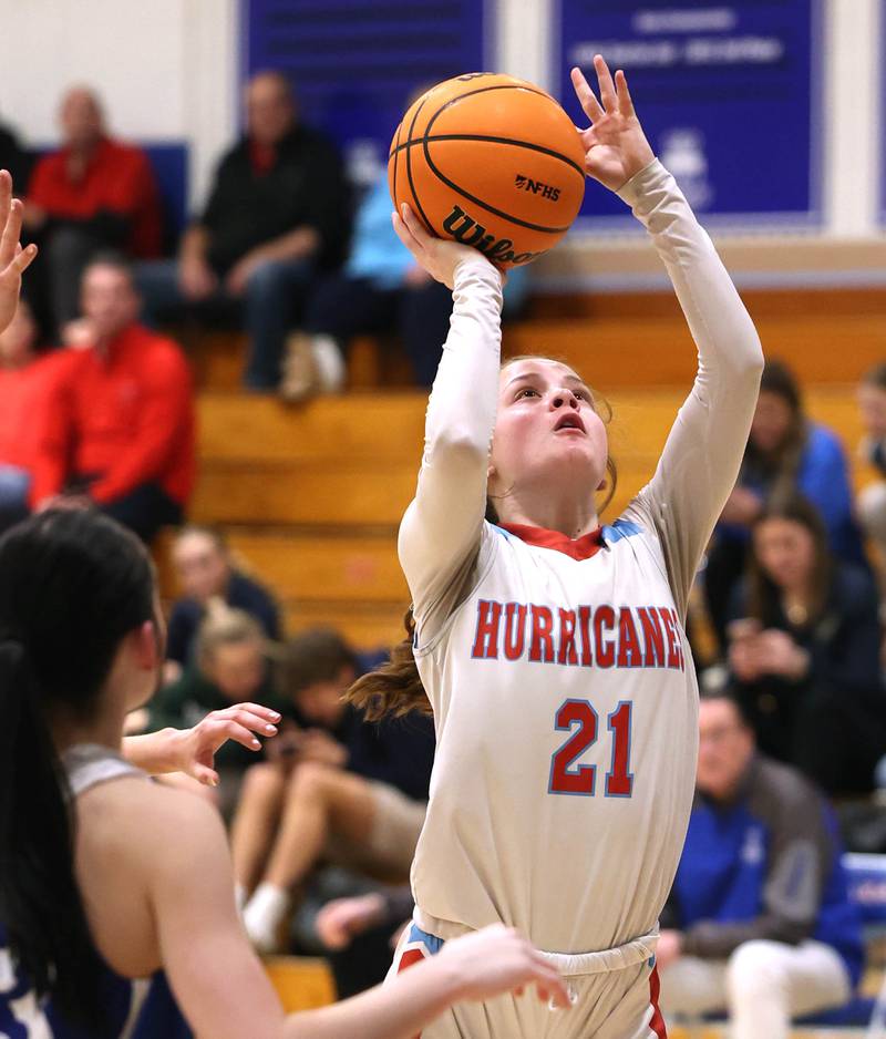 Marian Central's Lainey Remke gets a shot in the lane over Hinckley-Big Rock's Mia Cotton Monday, Feb. 16, 2026, during their regional semifinal game at Hinckley-Big Rock High School.