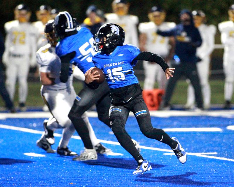 St. Francis quarterback Alex Taylor keeps the ball during a Class 5A first-round game against Sterling on Friday, Nov. 1, 2024 in Wheaton.
