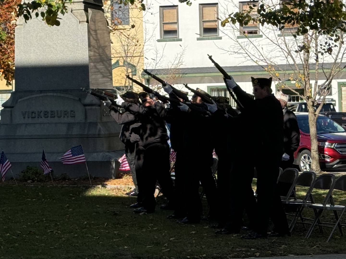 The Morris Color Guard honors fallen veterans with a 21-gun salute.