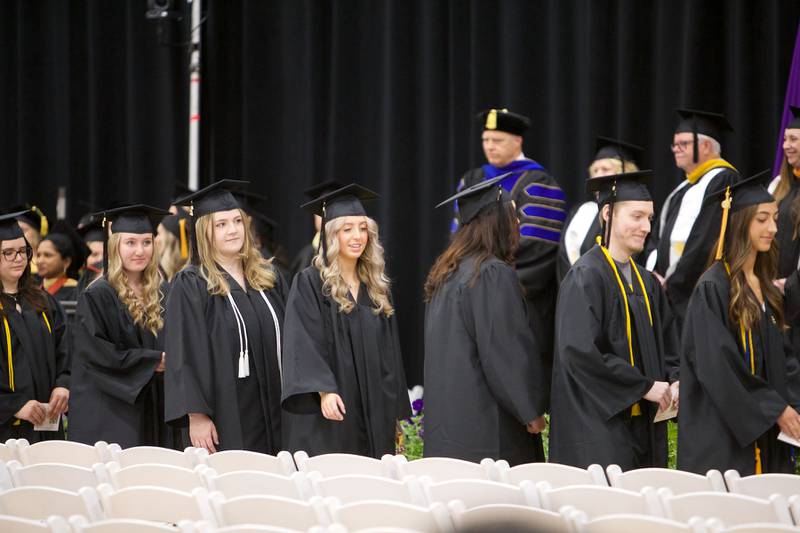 Graduates enter McHenry County College Gym for commencement on Saturday May 11, 2024, in Crystal Lake.