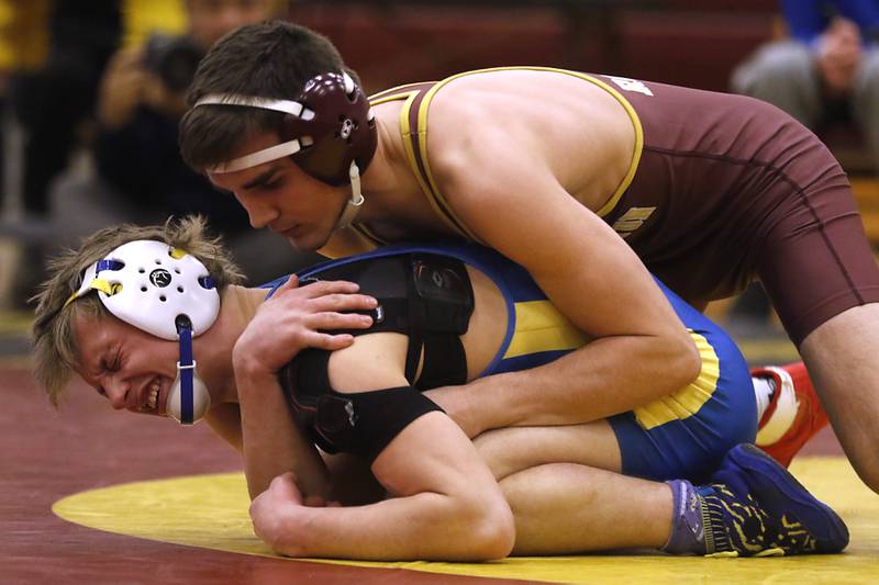 Johnsburg's Landon Johnson grabs his shoulder as Richmond-Burton's Dane Sorensen  tries to control him during the 138-pound match of a Kishwaukee River Conference wrestling match on Thursday, Jan. 25, 2024, at Richmond-Burton High School.